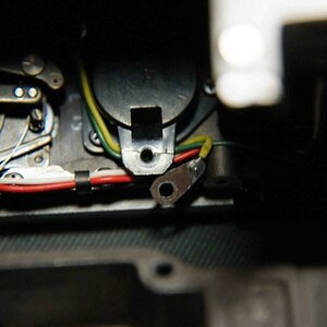 The battery chamber was cracked, and the tag corroded, see Photo 2. It surprised me power still got through....