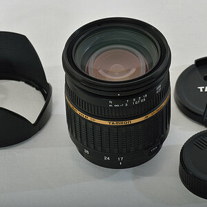 Tamron 17-50/2.8 DiII Stangen-AF:
Steinschlagschaden an der Frontlinse.