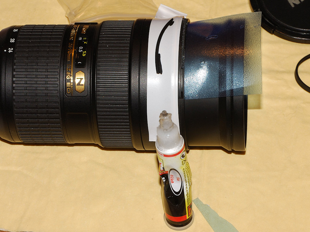 AF-S Nikkor 24-70/2.8G ED:
Ankleben einer abgebrochenen Bajonett-Zunge für die Sonnenblende