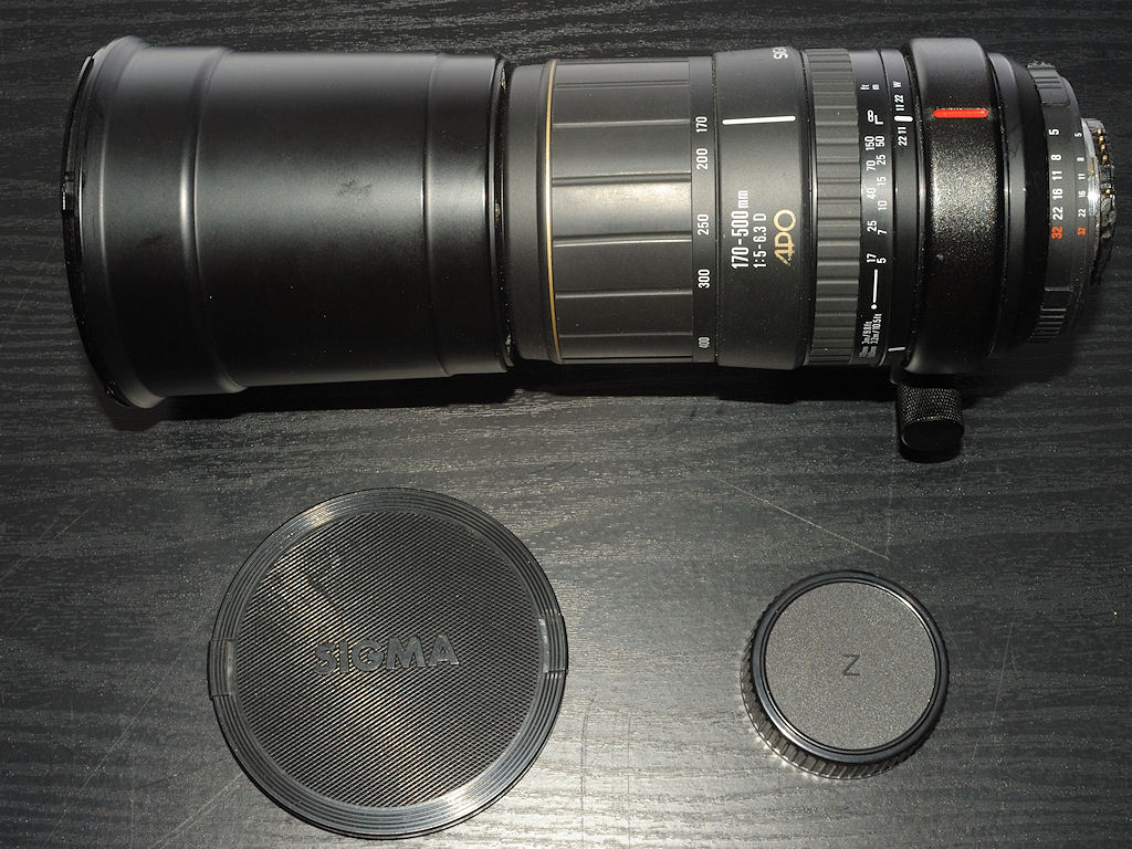 Mein defekt gekauftes und repariertes SIGMA AF 170-500 APO Telezoom:
Die CPU-Platine und alle Kabel waren herausgerissen, der Rear-Fokus-Trieb war an 