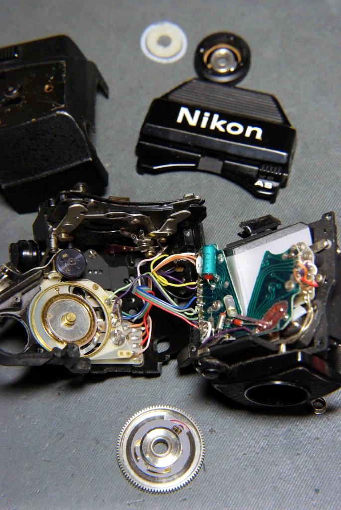 Sover found the following during the service :
 
- A cowboy had attempted to repair this DP-12 before:
  - The securing screw under the shutter speed 