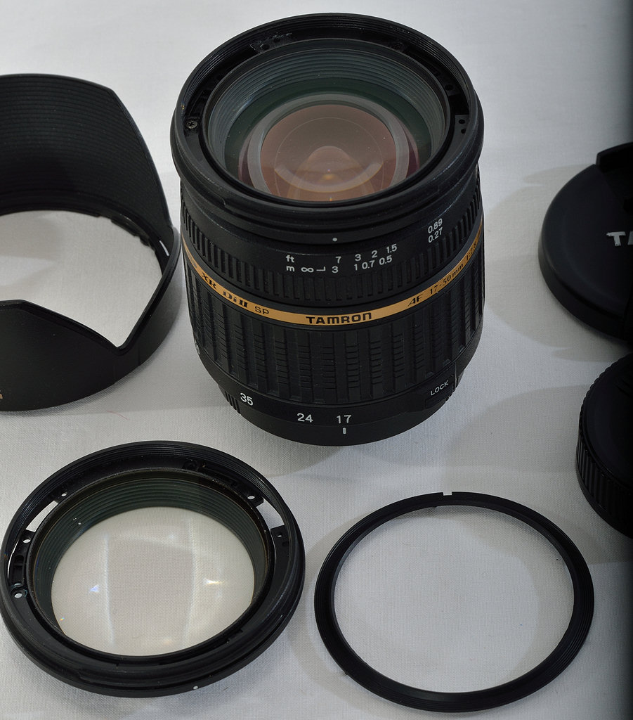Tamron 17-50/2.8 DiII Stangen-AF:
Austausch der Frontlinse.